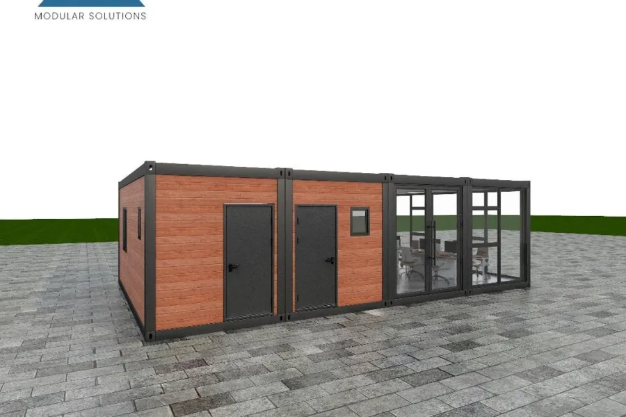 Side view of a modular office with black cladding and prominent glass entry.