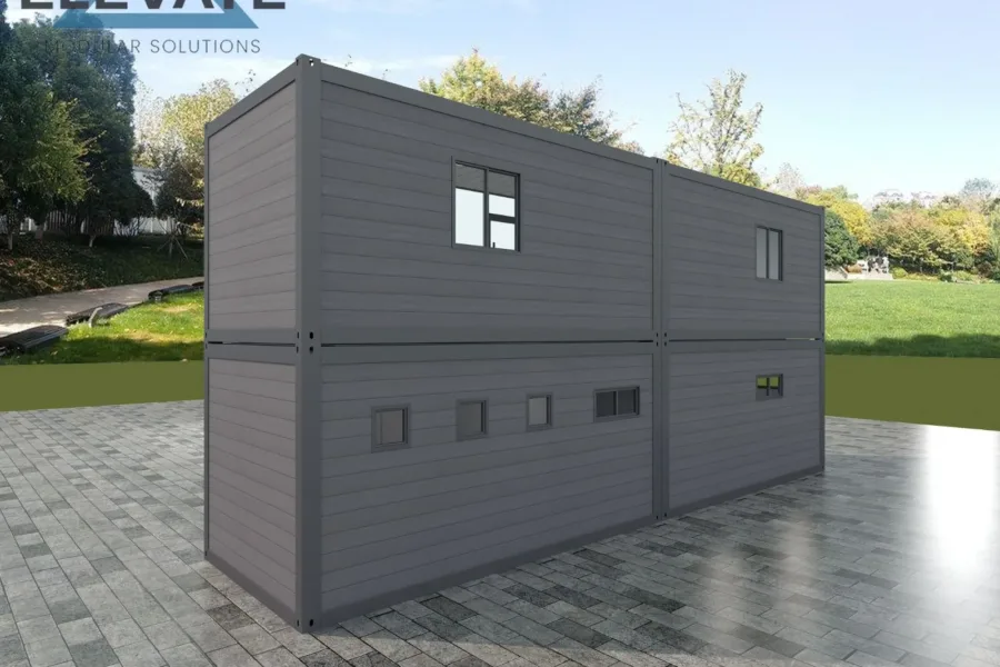 Rear view of two-storey modular office with multiple small windows.